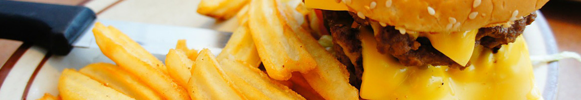 Eating American (Traditional) Burger Cheesesteak Salad at Firebox Grill restaurant in Chattanooga, TN.